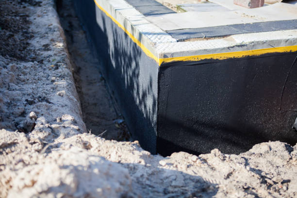 Professional Waterproofing technician working in Merrick, NY